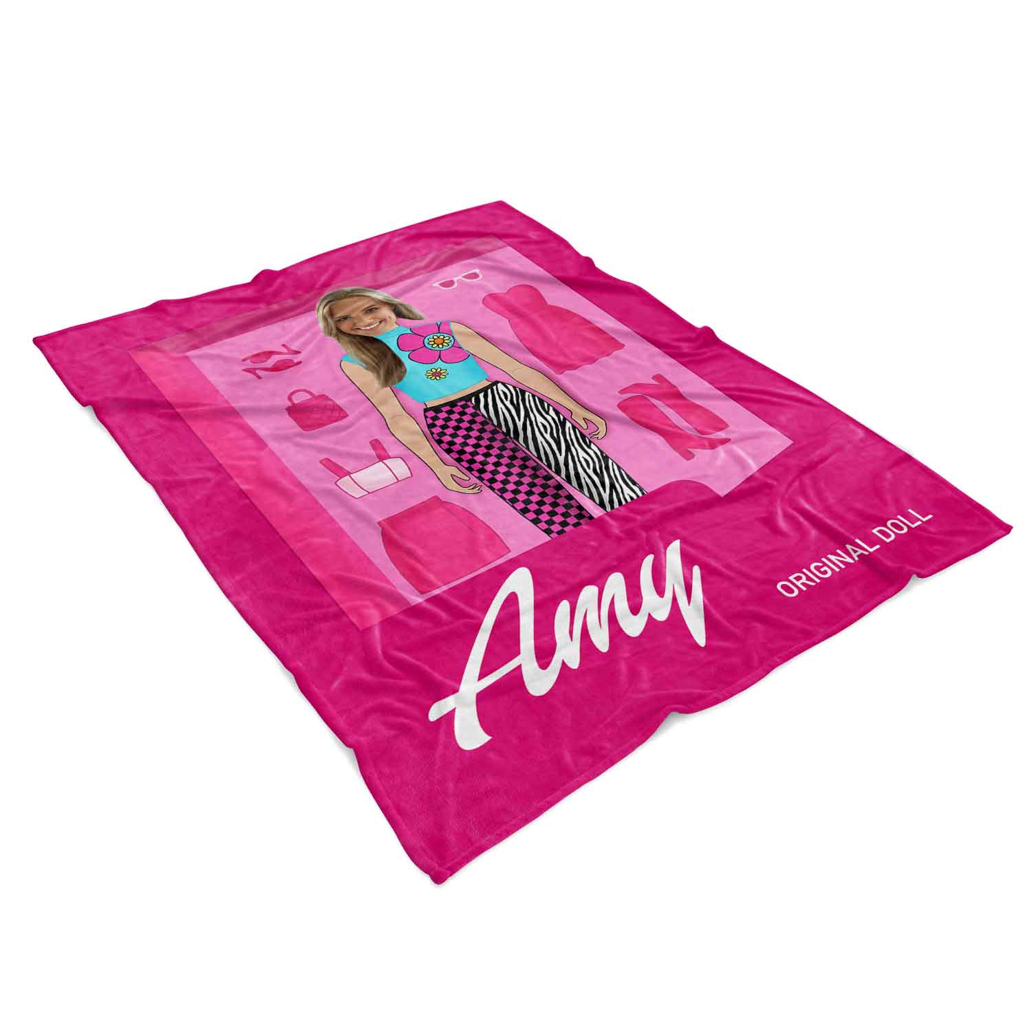 Pink play mat with doll and fashion items on a white background